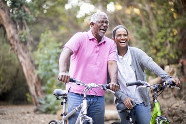 Older adult couple riding bikes to prevent diabetes with exercise