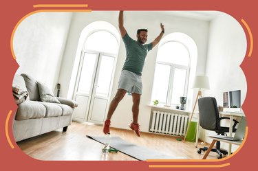 man wearing green shirt and orange sneakers jumping doing 30-day burpee challenge at home