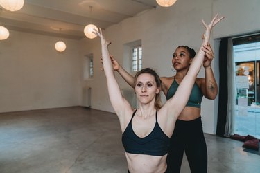 Private yoga lesson of a personal trainer in a yoga studio